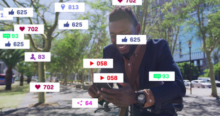 Smiling man in navy blazer checking phone while on bicycle in urban park, with social icons. Smile,...