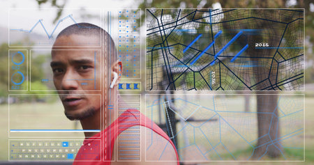 Looking mid-adult man turning over left shoulder in park, red sleeveless top, white earbud, HUD....