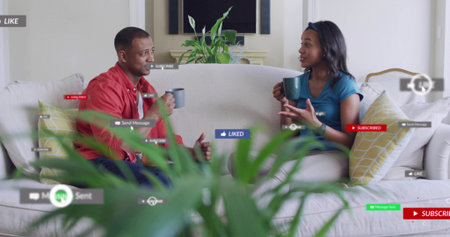 Talking couple at home on sofa in red shirt, teal top, holding mugs, plant, overlays floating....