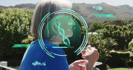 Standing senior wearing bright blue top holding wine glass and plate on balcony with AR graphics....