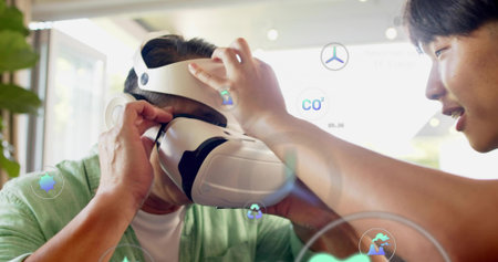 Adjusting helper securing white VR headset on user in light-green cardigan by window with AR icons....