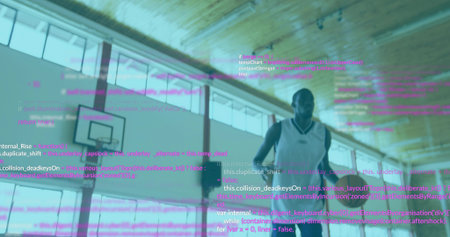 Standing player in sleeveless jersey and shorts in gym with hoop or backboard, windows, code...