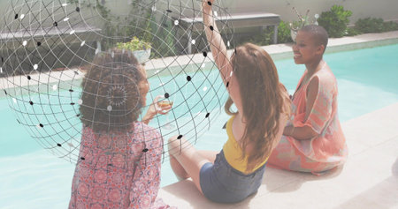 Chatting three women in pink, yellow and coral on pool deck, with stemmed glass, wireframe overlay....