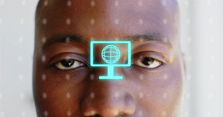 Displaying adult male face in close-up studio, with cyan holographic monitor icon and dotted lights....