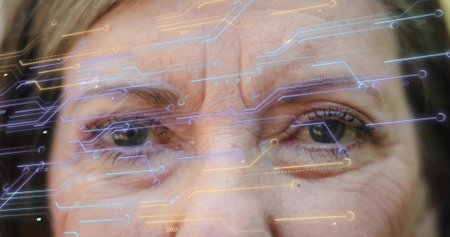 Showing senior woman's face highlighting eye and forehead wrinkles in studio, with circuit overlays....