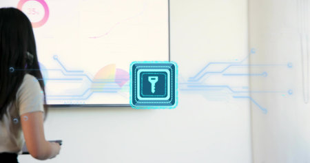 Presenting woman with remote in office in business, facing display with charts blue-key, copy space....