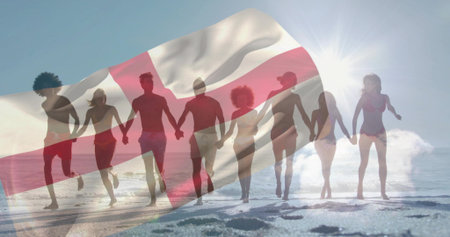 Running group eight adults holding hands and moving along sandy shoreline in swimwear. Silhouettes,...