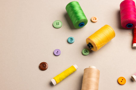Composition of sewing equipment on beige background with copy space. National craft month, sewing,...
