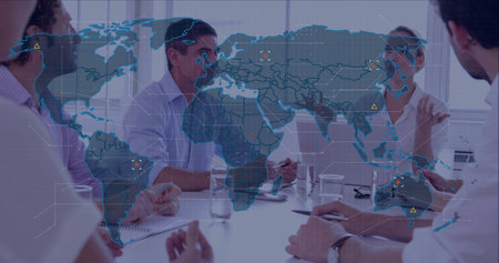 Discussing four colleagues taking notes in business-casual meeting room with world map overlay....