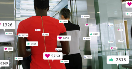 Heading colleague in red dress with gold zipper to elevator bank, with notification overlays, glass....