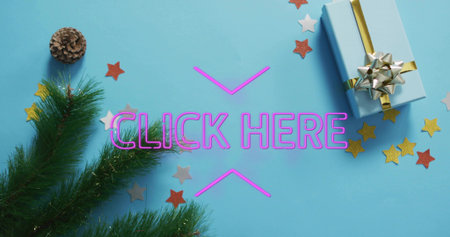 Displaying neon CLICK HERE sign with chevrons glowing on blue surface, with gift box, pinecone. Flatlay, holiday, promotion, present, evergreen, tinsel, confettiの写真素材
