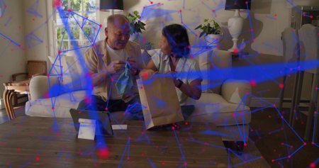 Inspecting casual couple examining small item in living room, woman holding brown paper bag. Sofa,...