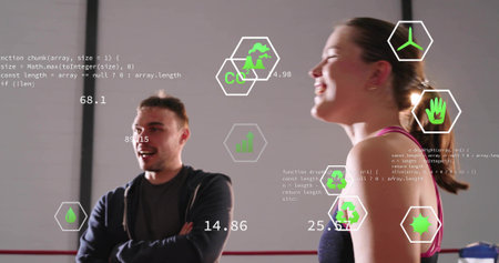Talking two adults in hoodie and pink-strapped tank at gym red rope, showing AR numeric metrics....