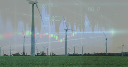 Showing large wind turbines stretching across rural grass field, with digital price charts overlay....