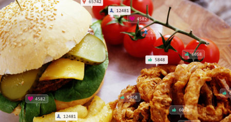 Showing sesame-bun burger sitting on wood board, with crinkle fries, onion rings, social icons....