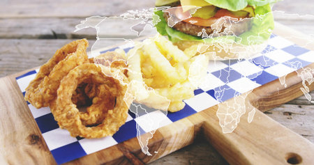 Showing wood board check paper with onion-rings, curly-fries, burger on rustic table, map overlay....
