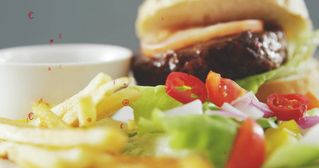 Featuring plated burger meal resting on plate at restaurant table, with fries and salad. Beef,...