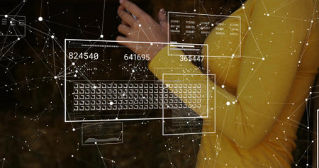 Holding woman in yellow top tapping phone at chest in dark studio, virtual keyboard, data web....