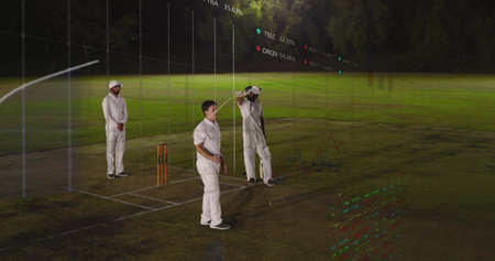 Standing three in cricket whites adjusting helmet, holding bat on pitch at night with stumps, HUD....