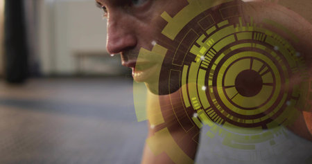 Training mid adult man sweating, bare-chested on gym mat, showing yellow-green HUD overlay. Athlete,...