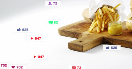 Showing board spilling paper cone fries with mustard, burger edge on white table, icons, copy space....