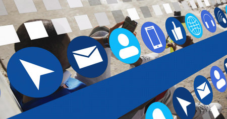 Using phone man wearing blue shirt sitting at park with bicycle, headphones, blue icons, copy space....
