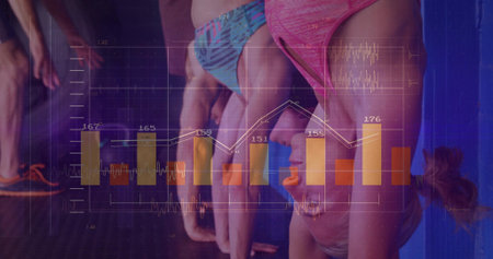 Doing four athletes in sportswear in handstand against blue padded wall at gym, with data charts....