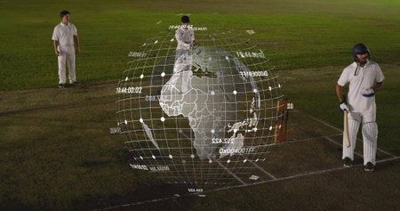 Projecting holographic globe over cricket pitch at night, white kit players with bat, helmet, pads....