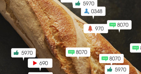 Showing single long baguette lying diagonally on dark countertop, with social notification overlays....