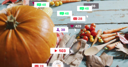 Featuring large orange pumpkin resting on pale-blue wooden table, with cutlery and social badges. Gourd, harvest, autumn, stilllife, rustic, surface, vegetablesの写真素材