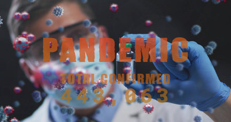 Holding mid adult scientist in PPE showing blue gloved vial in laboratory, pandemic overlay. Virus,...