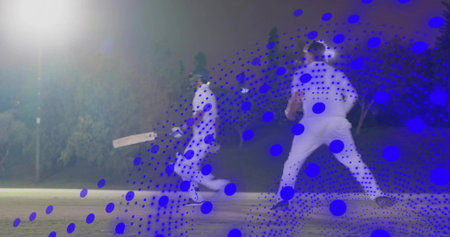 Running batsman and fielder wearing white kits holding bat on pitch, floodlight and blue overlay....