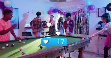 Playing friends leaning around green-felt pool table in rec room, woman in pink t-shirt holding cue....