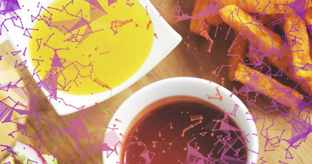 White bowls sitting on tabletop with yellow and red sauces, fries, green-garnish, purple overlay. Ceramic, dishware, dips, potato, crispy, golden, closeupの写真素材