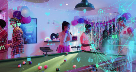 Playing guests in festive outfits around green-felt pool table at party room, with cues, AR overlay....