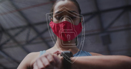 Checking female athlete tapping wrist watch at gym, in red mask, goggles, blue tank, AR overlay....