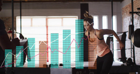 Doing lateral hop woman wearing peach tank at plyo box, coach noting clipboard, charts, copy space....