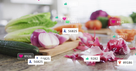 Displaying halved red onion and cucumber on wooden board at kitchen counter, with social icons....