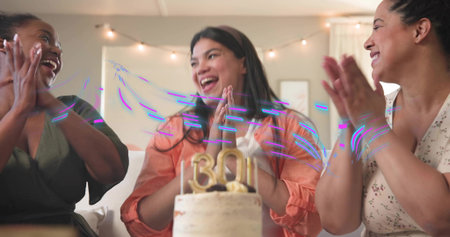 Clapping three women wearing green, orange, floral dresses celebrating at home, gold 30 cake topper....