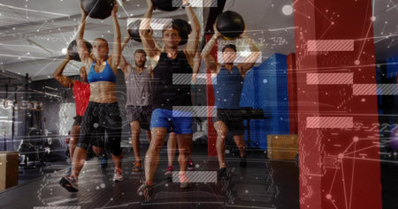 Lunging five adults holding black medicine balls overhead in gym studio wearing workout clothes HUD....