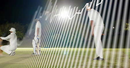 Bowling bowler following through on night pitch, batsman in white kit holding bat, keeper squatting....