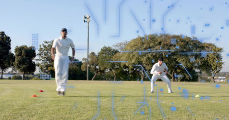 Running cricketer in white kit crouching mate training on cricket field with cones gloves overlay....