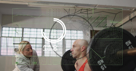 Lifting bald mid-adult man doing back squat at gym, with loaded barbell, spotter hoodie HUD overlay....
