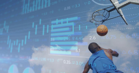 Leaping athlete in blue jersey dunking basketball at outdoor hoop with data overlays, copy space....
