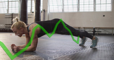 Holding forearm plank mid adult woman wearing dark workout clothes in gym with green graph overlay....