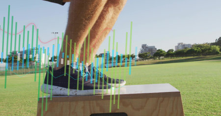 Stepping legs onto plyo box on field, navy sneakers light-blue laces, white crew socks data overlay. Outdoor, grass, athlete, training, fitness, platform, visualizationの写真素材