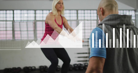 Squatting woman in red tank and black leggings training at gym, trainer observing, data overlays....