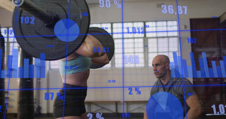 Lifting mid-adult woman hoisting loaded barbell in gym in sportswear, coach watching, data overlays....