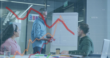 Presenting man in light blue shirt explaining flip chart diagrams at conference room, with laptop....
