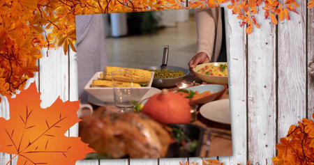 Serving group of adults passing salad bowl at dining table, wearing knit sweater, roasted turkey....
